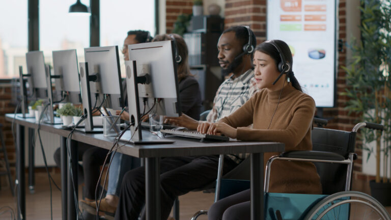 Asian woman with disability using a headset